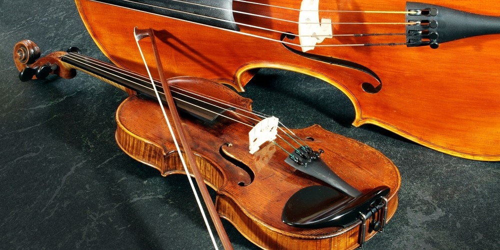 photo of a cello and a violine